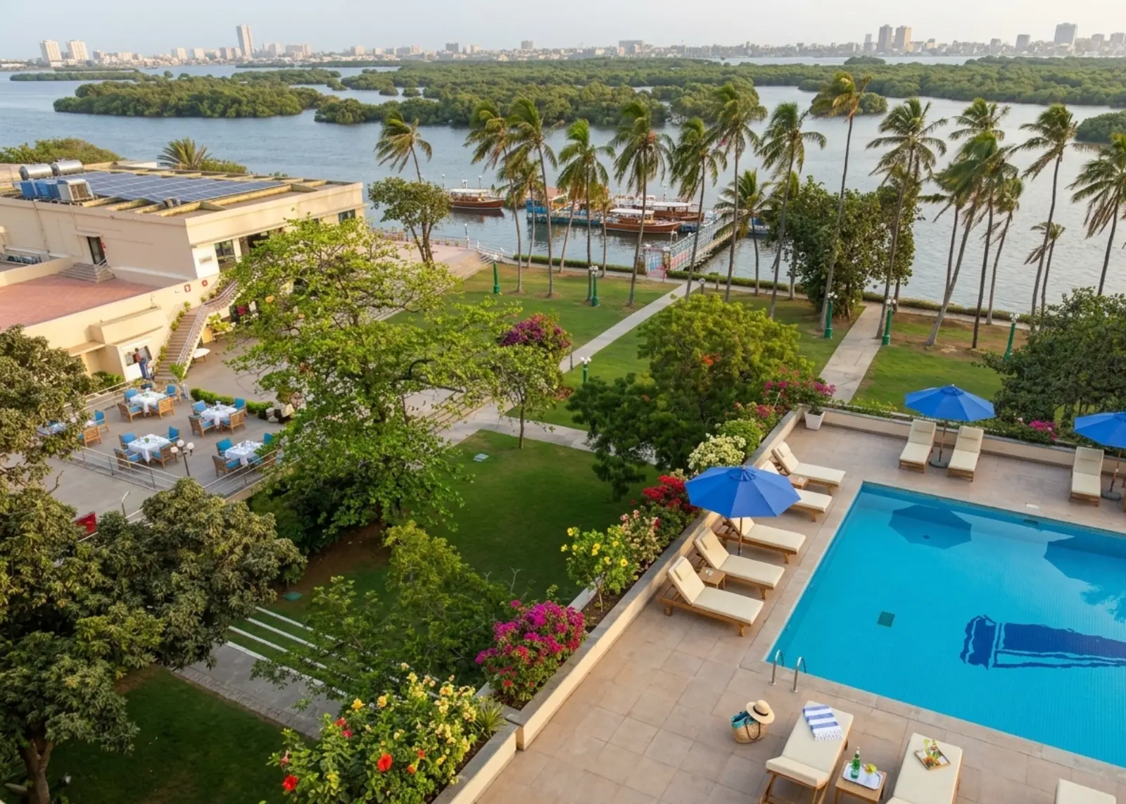 Panoramic view of pool, gardens and Karachi harbour from Beach Luxury Hotel