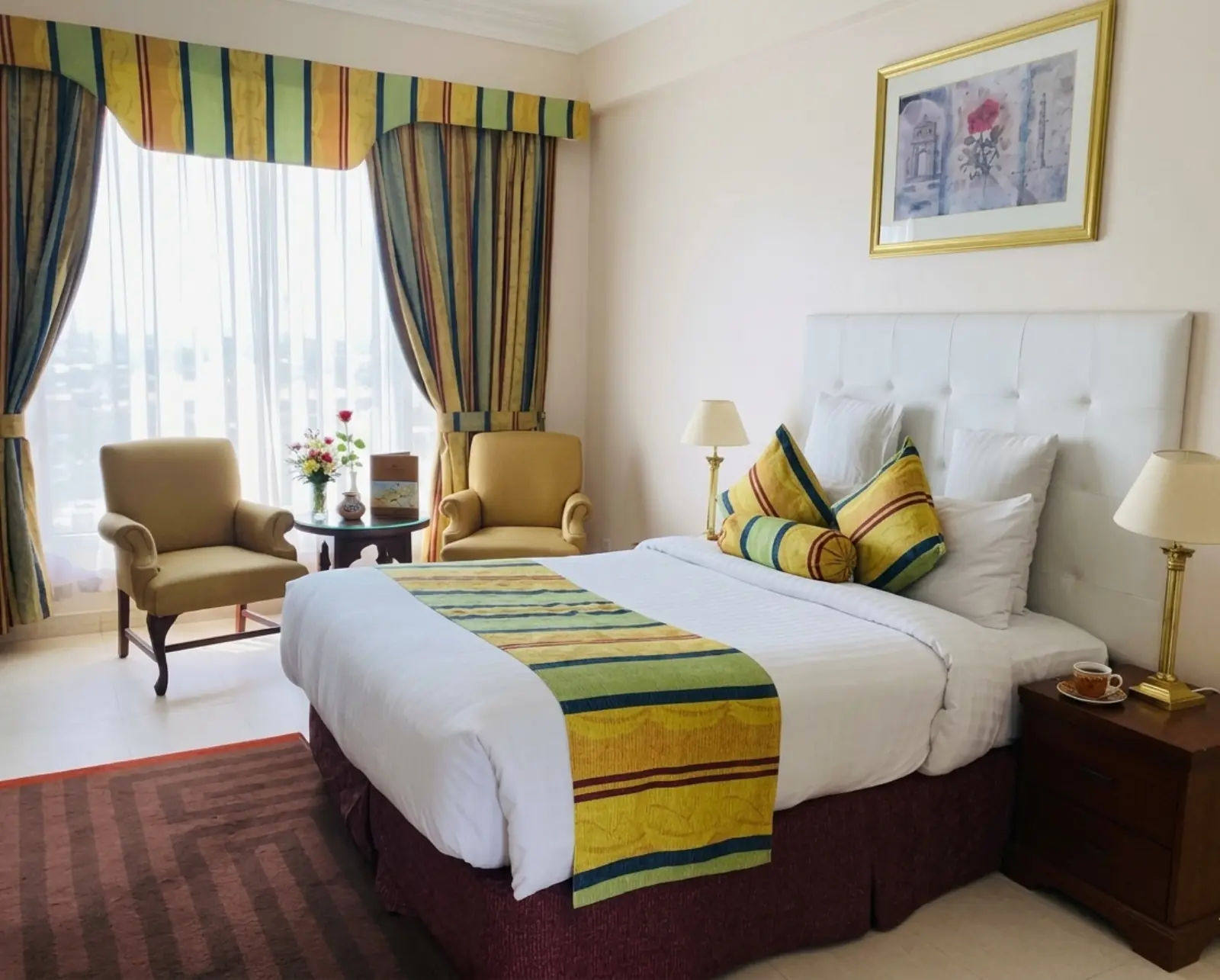 Elegant suite bedroom with classic décor and warm lighting