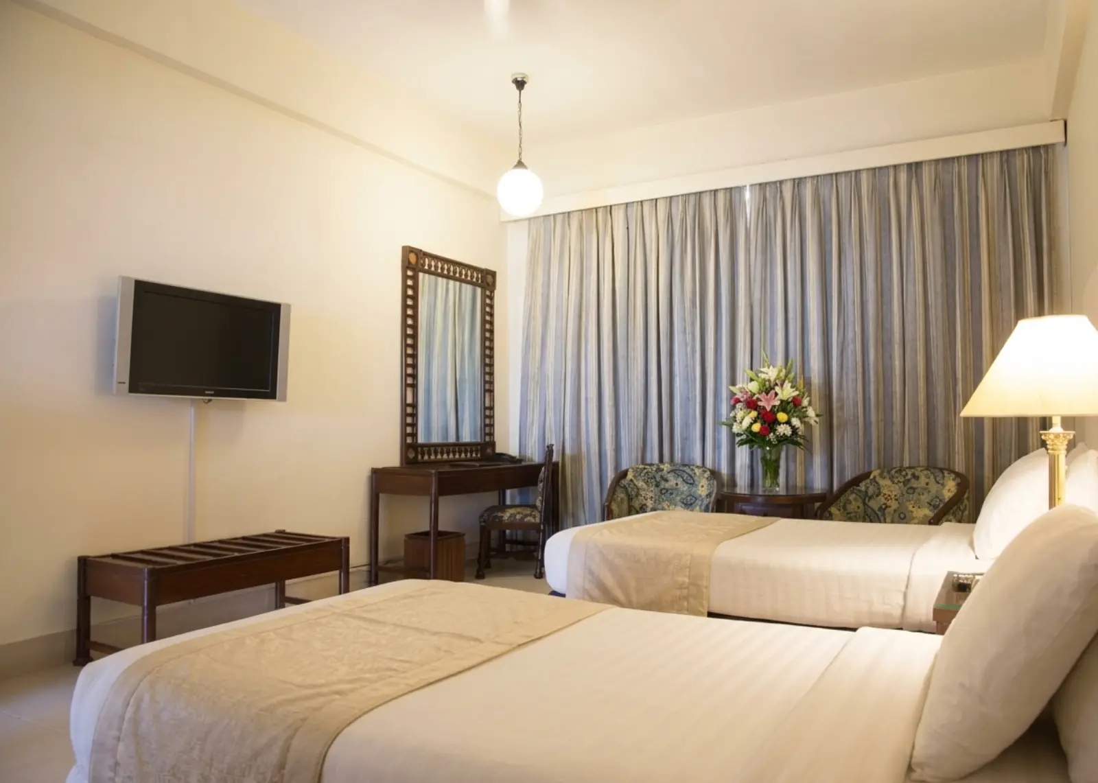 Twin room with two beds and elegant classic décor